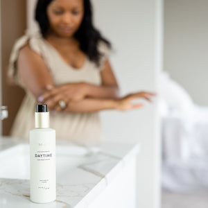 Woman Applying Body Lotion